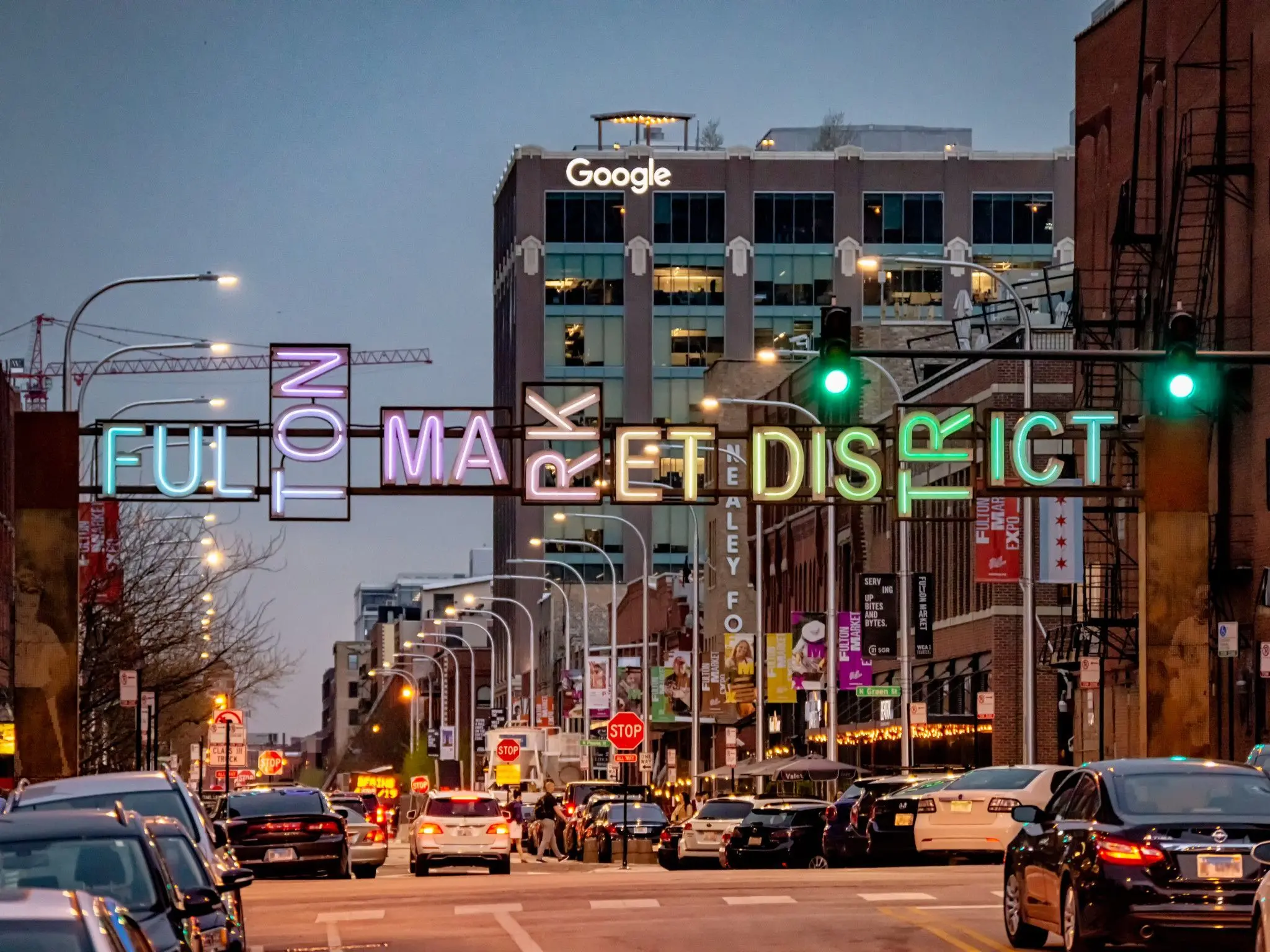 The Fulton Market District neon gateway sign at dusk
